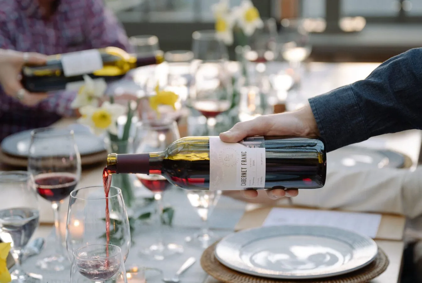 Pouring wine at a Vintner's Table